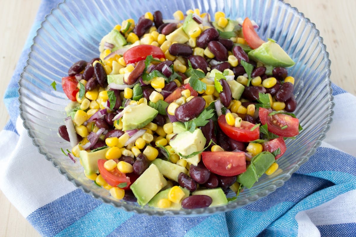 Black Bean Corn Avocado Salad with lime dressing served with homemade tortilla chips