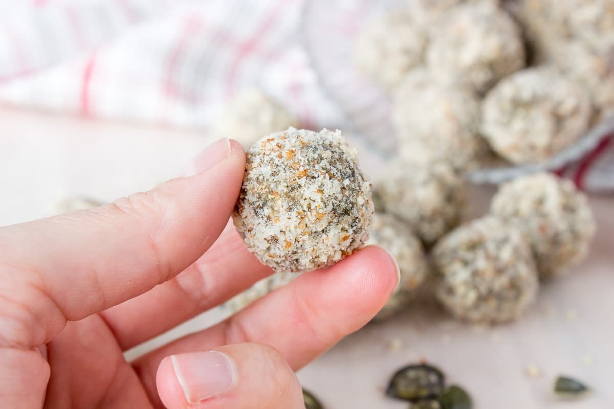Soft, fragrant, super healthy Pumpkin Seeds Energy Balls made without added sugars. These energy balls are very nutritious, full of fibers, proteins, and healthy fats. An ideal healthy snack between meals. CLICK to grab recipe PIN for later! | Natalie's Food & Health | natalieshealth.com