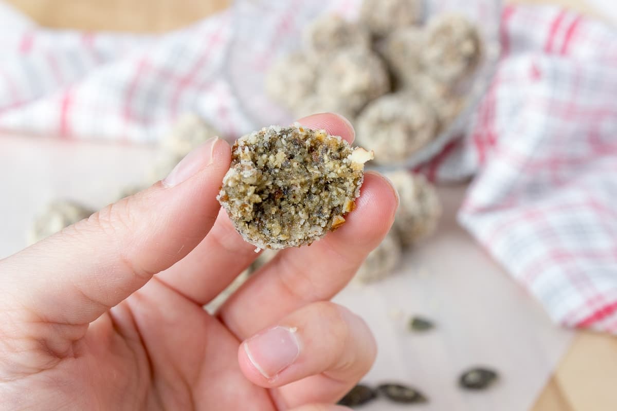 Soft, fragrant, super healthy Pumpkin Seeds Energy Balls made without added sugars. These energy balls are very nutritious, full of fibers, proteins, and healthy fats. An ideal healthy snack between meals. CLICK to grab recipe PIN for later! | Natalie's Food & Health | natalieshealth.com
