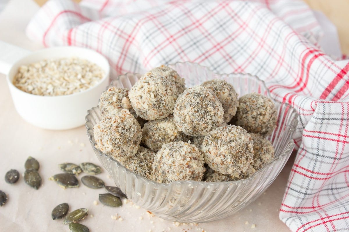 Soft, fragrant, super healthy Pumpkin Seeds Energy Balls made without added sugars. These energy balls are very nutritious, full of fibers, proteins, and healthy fats. An ideal healthy snack between meals. CLICK to grab recipe PIN for later! | Natalie's Food & Health | natalieshealth.com