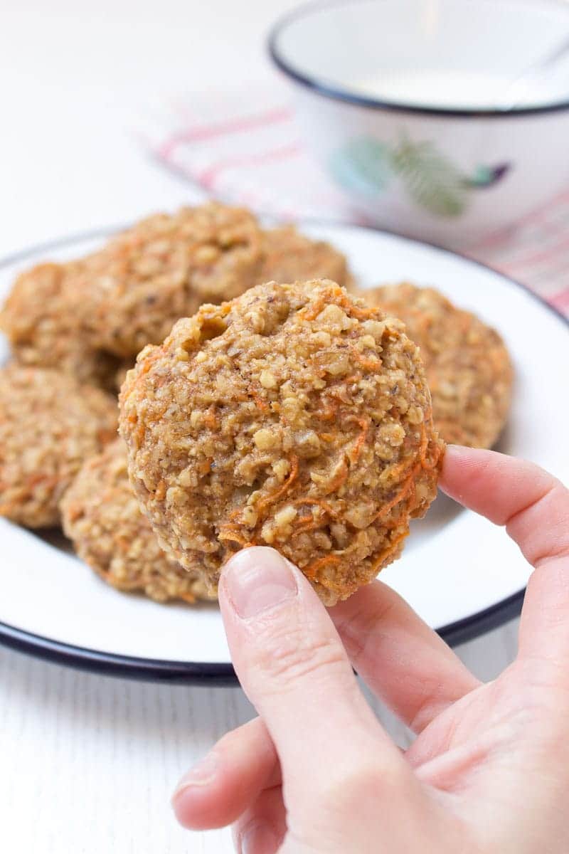 Healthy wholegrain Carrot Cake Oatmeal Cookies filled with oats, grated carrots, ginger, and walnuts. These cookies are low-fat, refined sugar-free, kid-friendly and super easy to make. Perfect breakfast or snack. #sugarfree #healthy #easy #snack #brakfast #cookies #easter #spring