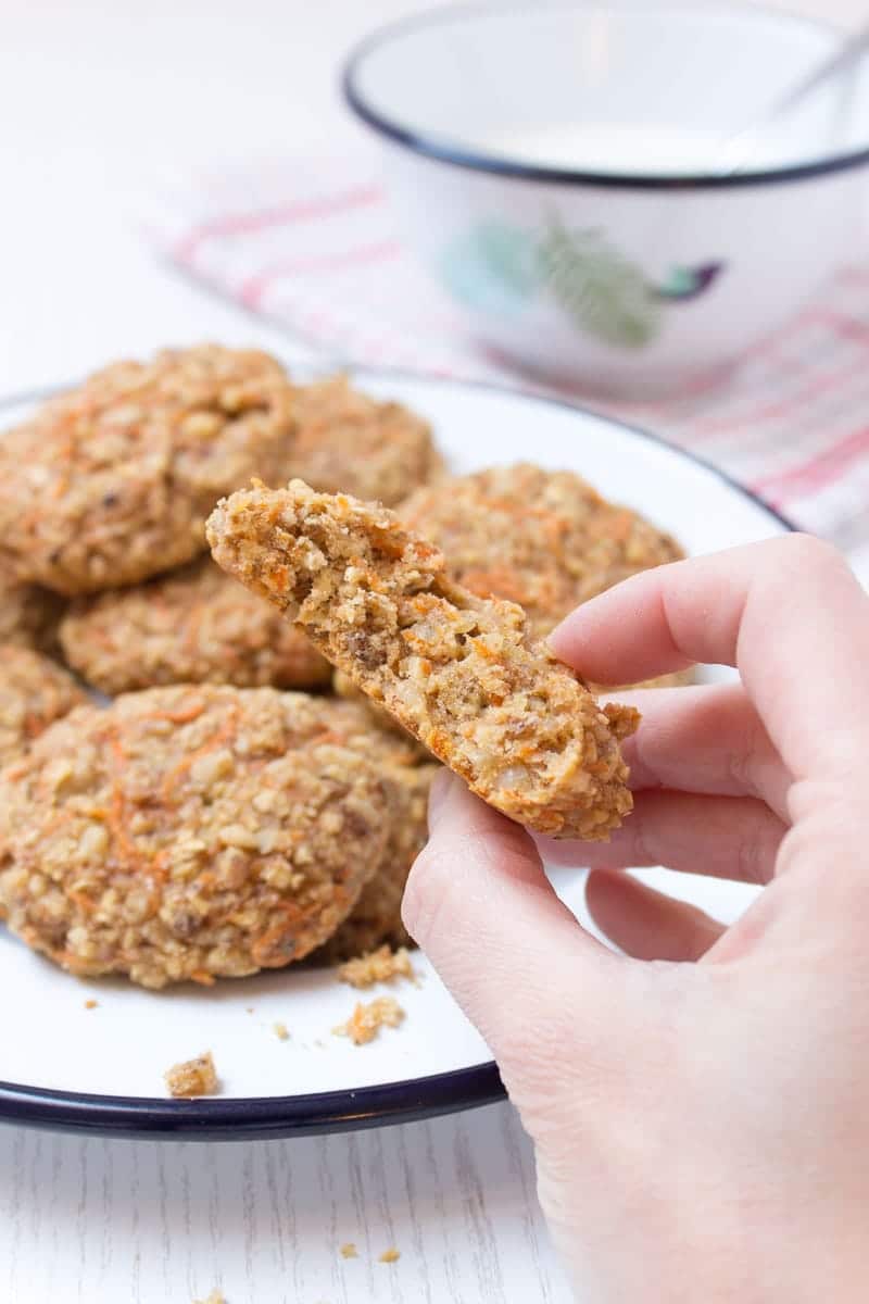 Healthy wholegrain Carrot Cake Oatmeal Cookies filled with oats, grated carrots, ginger, and walnuts. These cookies are low-fat, refined sugar-free, kid-friendly and super easy to make. Perfect breakfast or snack. #sugarfree #healthy #easy #snack #brakfast #cookies #easter #spring