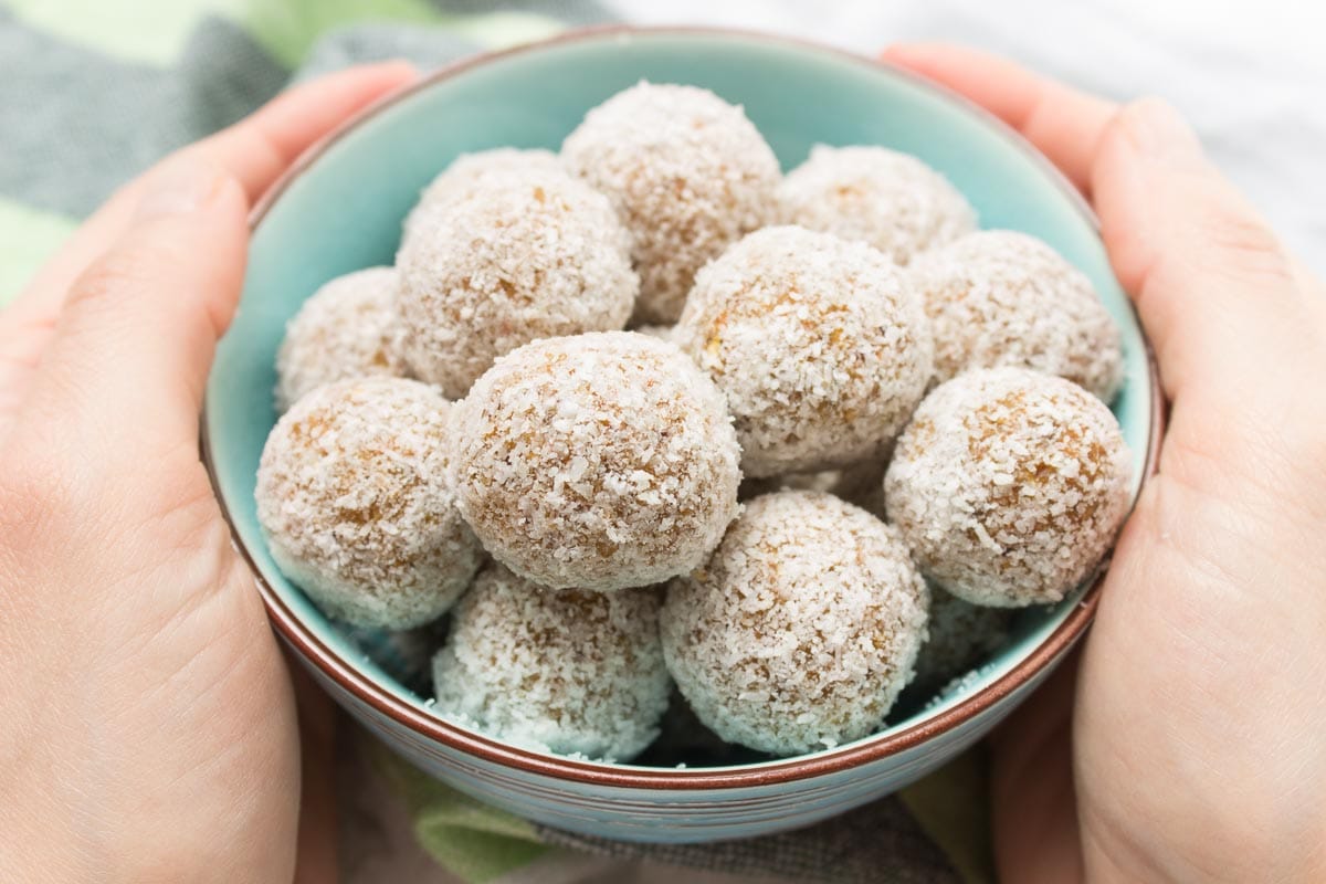 Raw no-bake Carrot Cake Energy Balls made with all HEALTHY ingredients. These yummy bites are refined sugar-free, gluten-free and vegan. Perfect snack, a post-workout snack or simple dessert. | natalieshealth.com | #vegan #glutenfree #sugarfree #Easter #healthy #easy #whole30