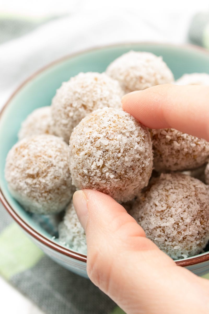 Raw no-bake Carrot Cake Energy Balls made with all HEALTHY ingredients. These yummy bites are refined sugar-free, gluten-free and vegan. Perfect snack, a post-workout snack or simple dessert. | natalieshealth.com | #vegan #glutenfree #sugarfree #Easter #healthy #easy #whole30