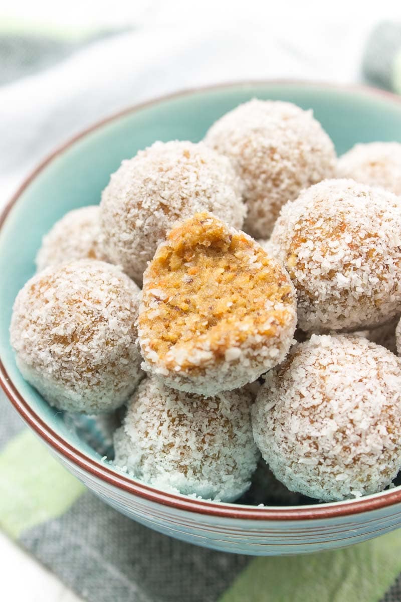 Raw no-bake Carrot Cake Energy Balls made with all HEALTHY ingredients. These yummy bites are refined sugar-free, gluten-free and vegan. Perfect snack, a post-workout snack or simple dessert. | natalieshealth.com | #vegan #glutenfree #sugarfree #Easter #healthy #easy #whole30