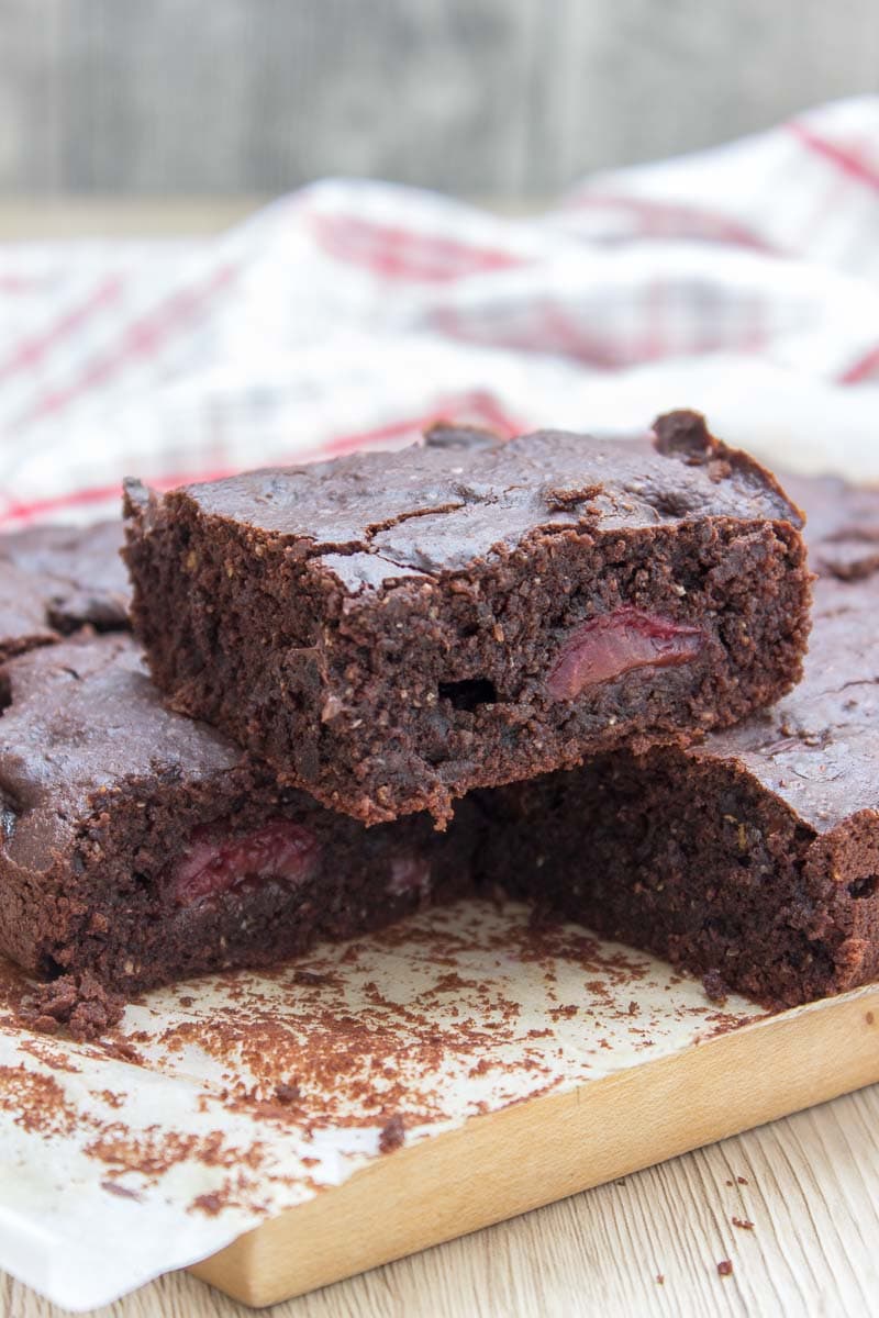 Rich, decadent, and chocolatey, these refined sugar-free Dark Chocolate Cherry Brownies are destined to delight you. Made with all HEALTHY ingredients, loaded with dark chocolate and sweet cherries, these brownies are truly a chocolate lover’s dream! #healthy #wholegrain #sugarfree #chocolate #cherry #lowcalorie #dairyfree#summer #whole30 #weightloss | natalieshealth.com 