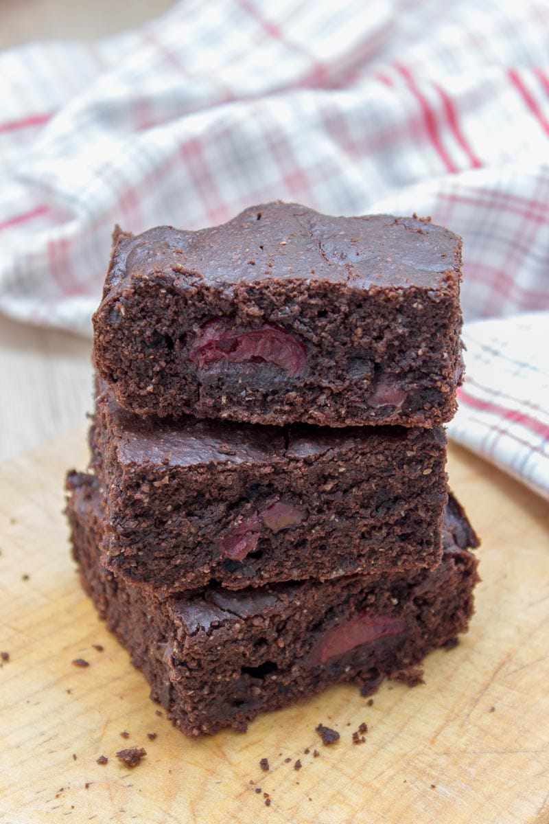 Rich, decadent, and chocolatey, these refined sugar-free Dark Chocolate Cherry Brownies are destined to delight you. Made with all HEALTHY ingredients, loaded with dark chocolate and sweet cherries, these brownies are truly a chocolate lover’s dream! #healthy #wholegrain #sugarfree #chocolate #cherry #lowcalorie #dairyfree#summer #whole30 #weightloss | natalieshealth.com 