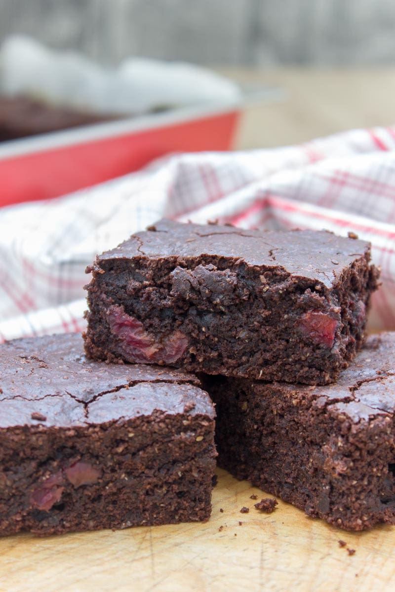 Rich, decadent, and chocolatey, these refined sugar-free Dark Chocolate Cherry Brownies are destined to delight you. Made with all HEALTHY ingredients, loaded with dark chocolate and sweet cherries, these brownies are truly a chocolate lover’s dream! #healthy #wholegrain #sugarfree #chocolate #cherry #lowcalorie #dairyfree#summer #whole30 #weightloss | natalieshealth.com 