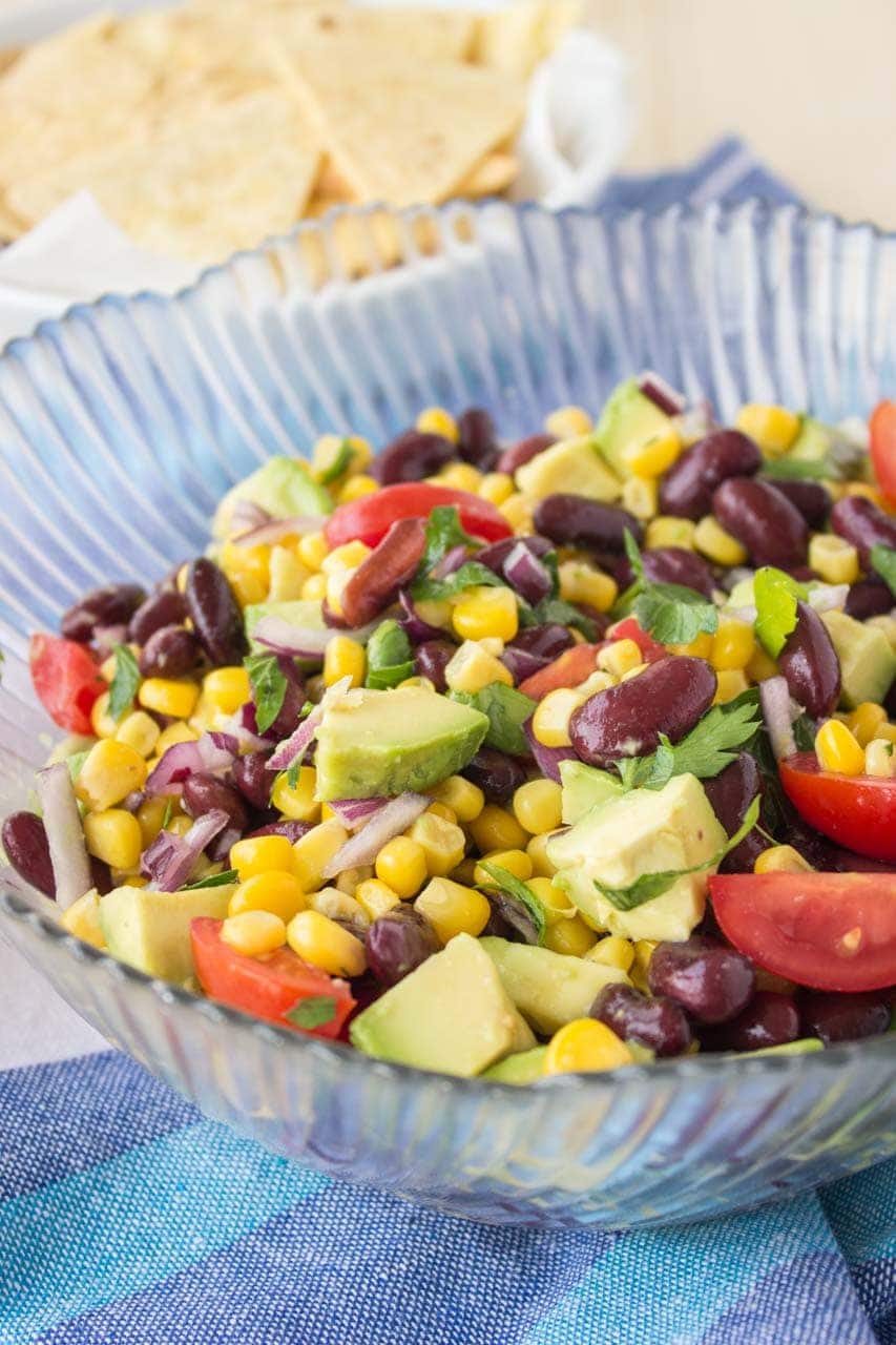 Black Bean Corn Avocado Salad with lime dressing served with homemade tortilla chips