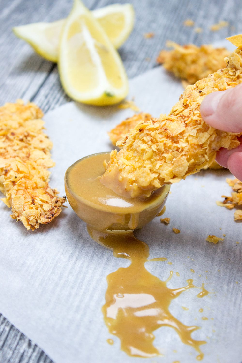 Crispy Baked Cornflake Chicken Tenders made without added fat are the perfect low-calorie, quick and HEALTHY family meal. Served with homemade Honey Dijon Sauce, these tenders are delicious gameday finger food too. CLICK to read more or PIN for later! 