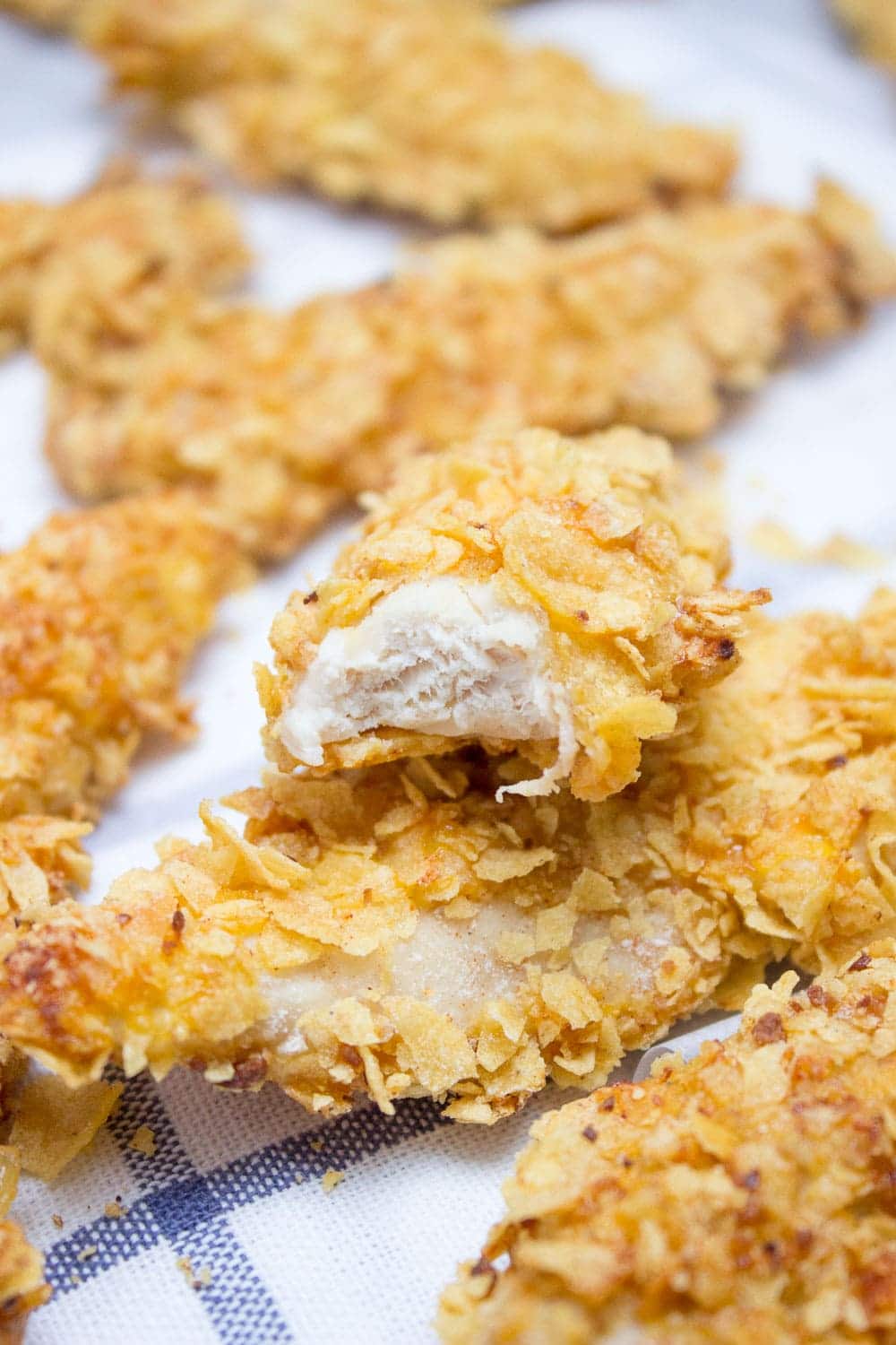 Crispy Baked Cornflake Chicken Tenders made without added fat are the perfect low-calorie, quick and HEALTHY family meal. Served with homemade Honey Dijon Sauce, these tenders are delicious gameday finger food too. CLICK to read more or PIN for later! 