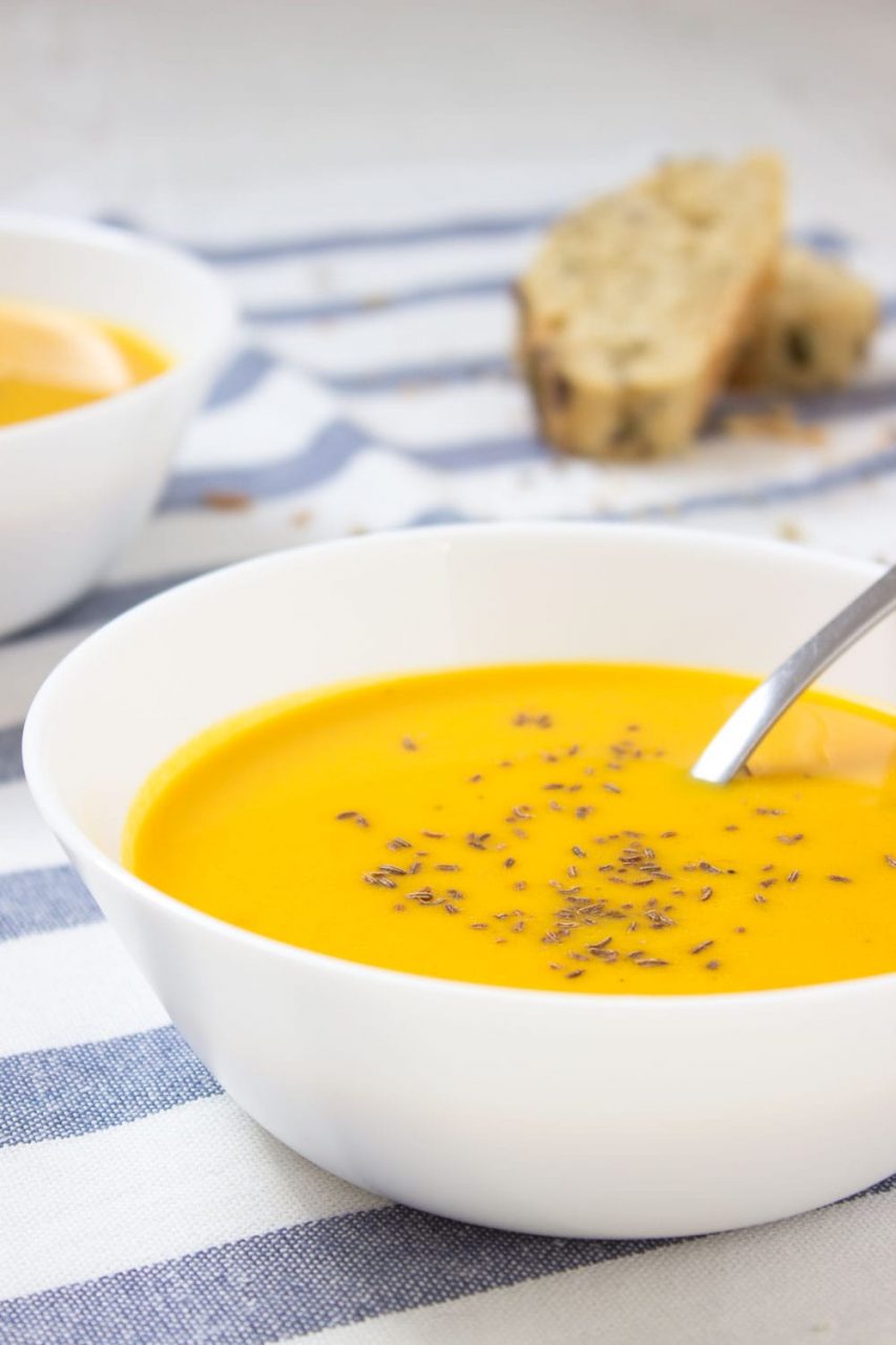 Easy Carrot Ginger Soup made with all healthy ingredients, enriched with healing spices - ginger and turmeric. Low-fat and warming, this immune boosting soup makes a healthy lunch or dinner. CLICK to read more or PIN fro later! natalieshealth.com #vegan #glutenfree #dairyfree #dinner #soup #easy #vegetarian #paleo