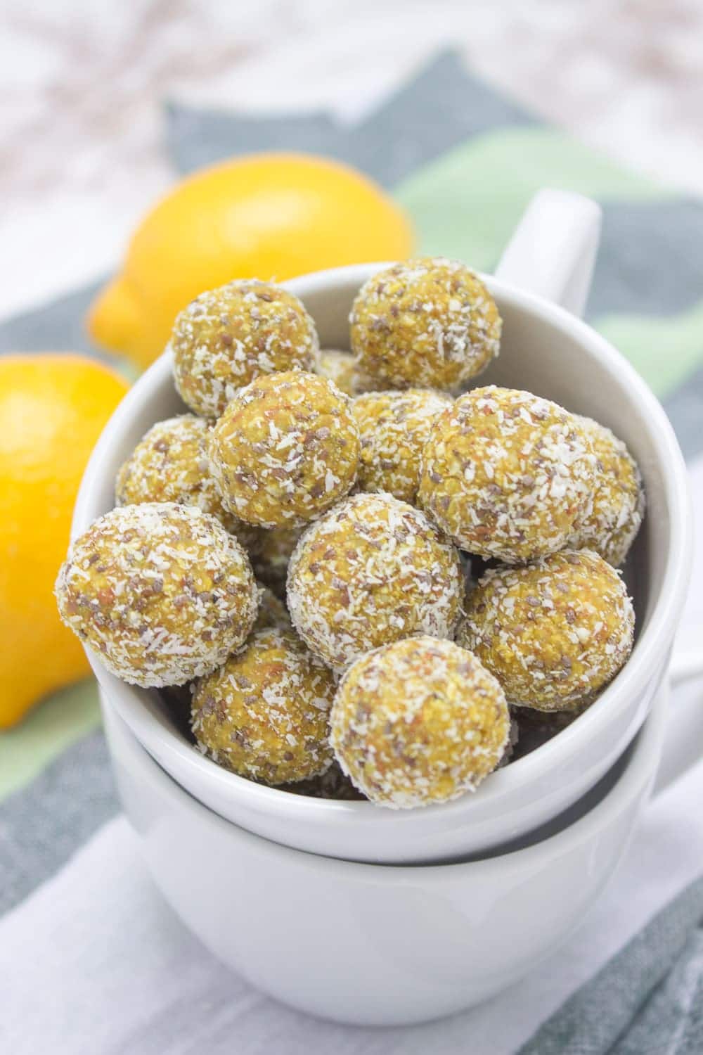 Lemon Turmeric Energy Balls full of beautiful citrus aroma enriched with healing spice - TURMERIC, and superfood - CHIA SEEDS. These immune boosting, refined sugar-free energy balls are rich in fibers and plant-based proteins. Perfect for everyday snacking. #vegan #glutenfree #healthy #turmeric #chia #lowcarb #nosugar #sugarfree #raw #nobake #balls | www.natalieshealth.com