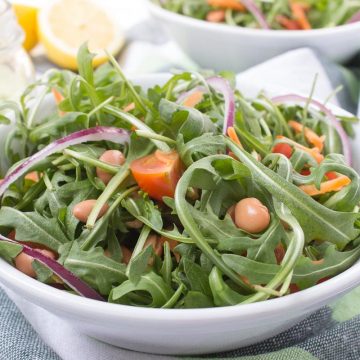 Arugula Beans Salad topped with creamy avocado dressing is a simple yet delicious HEALTHY meal. This very nutritious spring salad is easy to made and can be eaten anytime. CLICK to grab the recipe or PIN for later! natlieshealth.com #vegan #glutenfree #vegetarian #healthy #salad