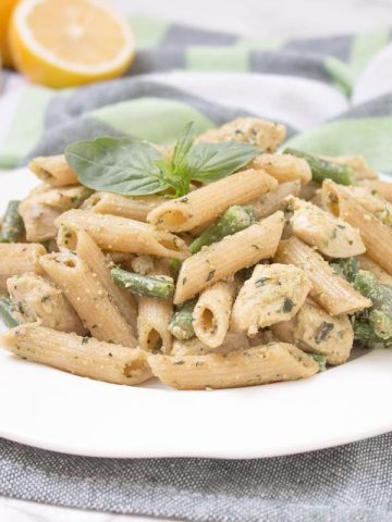 Easy Basil Pesto Chicken Pasta is the perfect HEALTHY weeknight meal for busy days. Packed with flavors and ready under 20 minutes! CLICK to read the recipe or PIN for later. [natalieshealth.com] #recipe #healthy #easy #family #chicken #low-fat #pasta #pesto