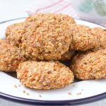 Healthy wholegrain Carrot Cake Oatmeal Cookies filled with oats, grated carrots, ginger, and walnuts. These cookies are low-fat, refined sugar-free, kid-friendly and super easy to make. Perfect breakfast or snack. NATALIESHEALTH.COM #sugarfree #healthy #easy #snack #breakfast #cookies #easter #spring