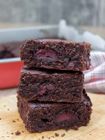 Rich, decadent, and chocolatey, these refined sugar-free Dark Chocolate Cherry Brownies are destined to delight you. Made with all HEALTHY ingredients, loaded with dark chocolate and sweet cherries, these brownies are truly a chocolate lover’s dream! #healthy #wholegrain #sugarfree #chocolate #cherry #lowcalorie #dairyfree#summer #whole30 #weightloss | natalieshealth.com