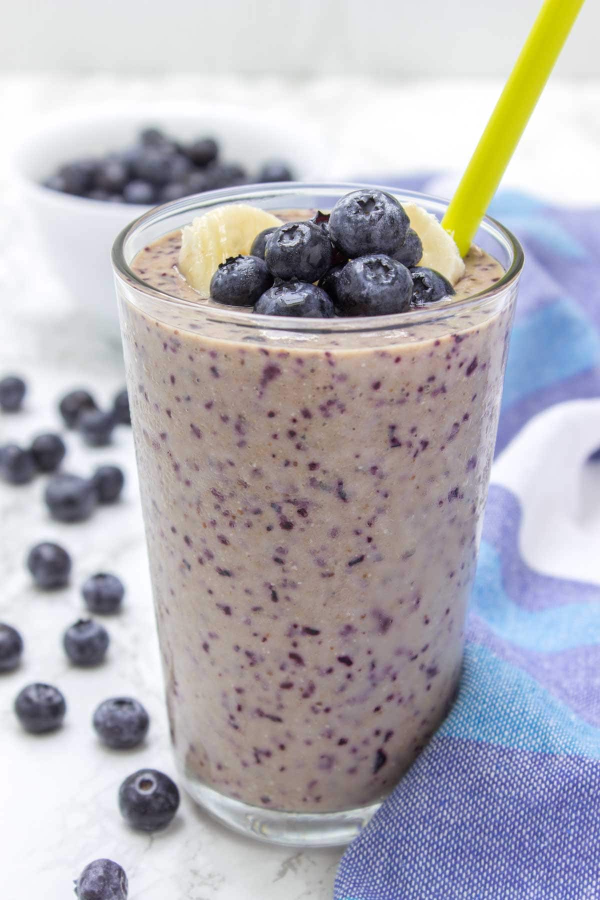 Blueberry Banana Chia Smoothie is the ultimate morning breakfast smoothie! It’s HEALTHY, deliciously creamy and SO satisfying + refined sugar-free and packed with nutrients and powerful antioxidants. #smoothie #summer #fit #workout #sugarfree #healthy #kidsfriendly #whole30 #weightloss #skinny #lowcalorie | natalieshealth.com