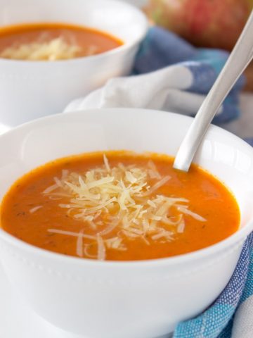 A creamy Tomato Apple Soup made with all FRESH whole ingredients is perfect immune boosting soup for upcoming colder days. Enriched with healing spice - turmeric, this soup is bursting with flavors and ready in just 30 minutes. #soup #whole30 #healthy #vegan #glutenfree #healthy #easy #apple #tomato #homemade | www.natalieshealth.com