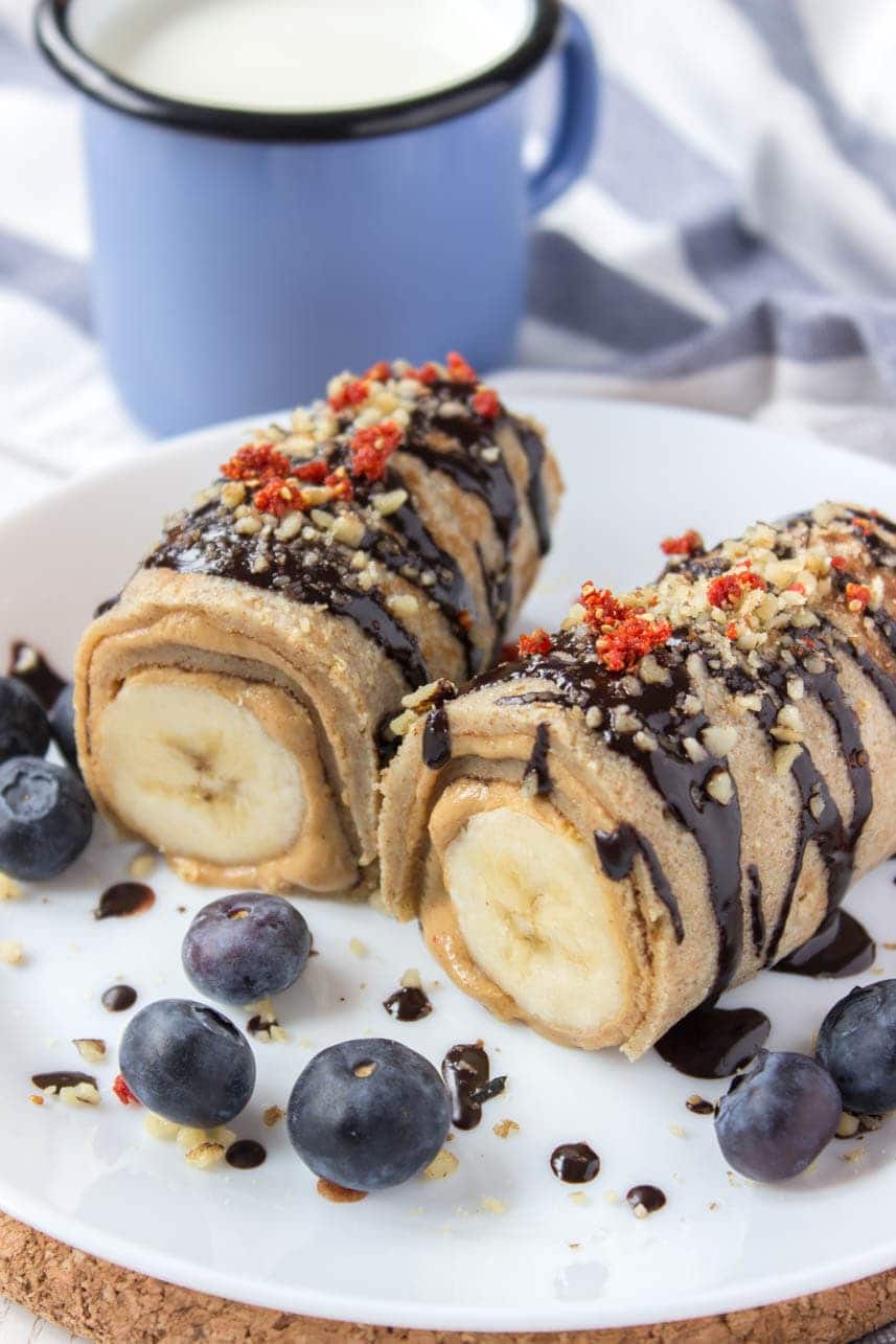 Chocolate Peanut Butter Banana Roll Ups drizzled with dark chocolate