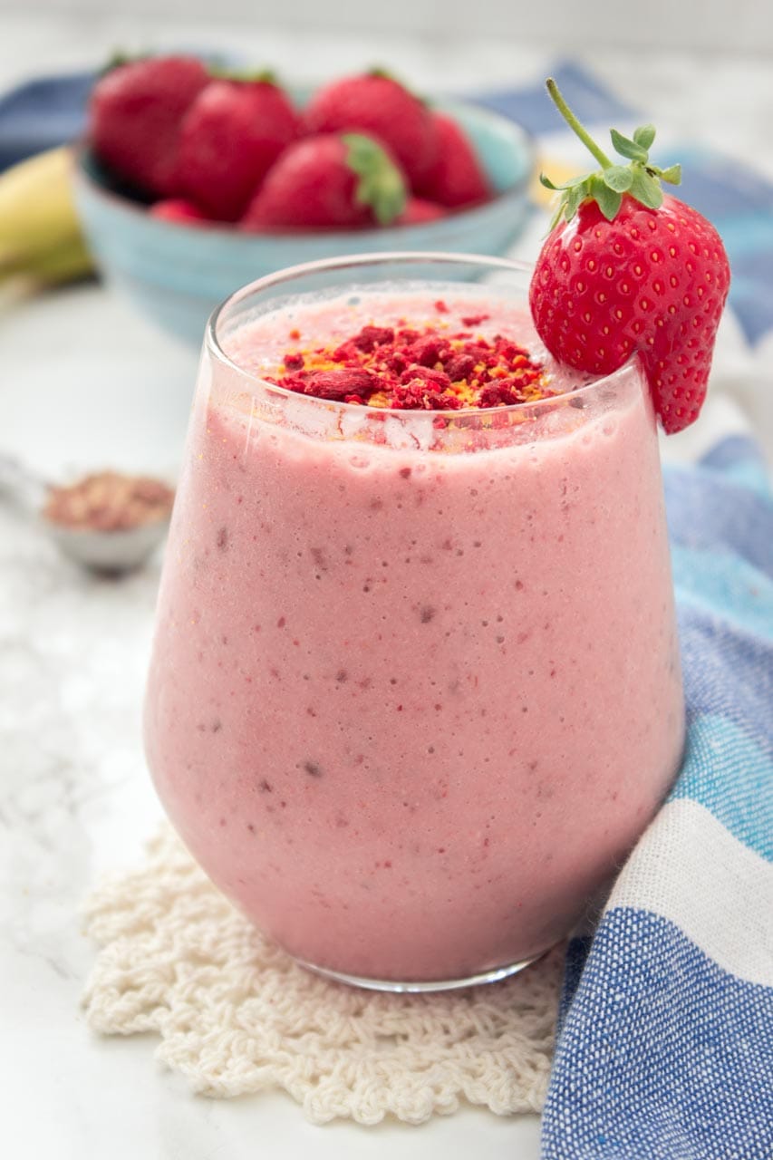 Strawberry Peanut Butter Smoothie with banana and flaxseeds topped with superfoods