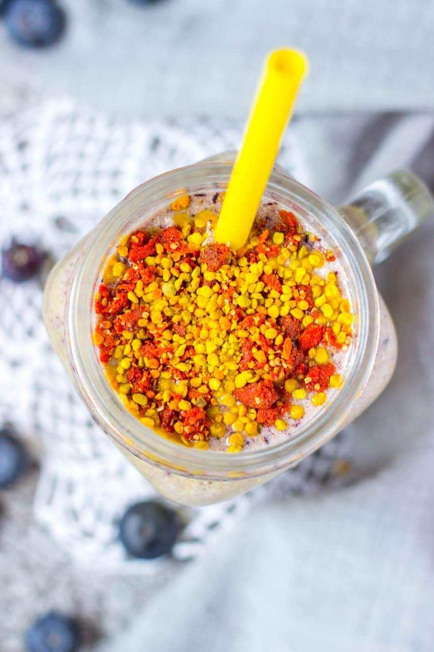 Mango Blueberry Smoothie topped with goji berries and bee pollen