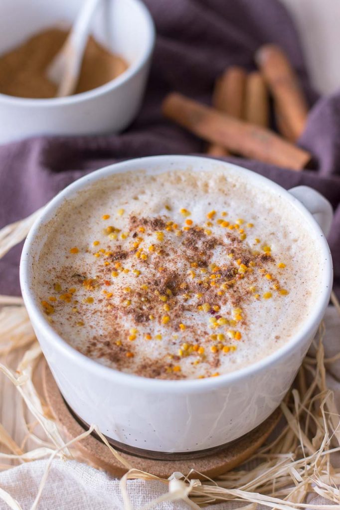 Healthy homemade Pumpkin Spice Latte served in a cup topped with frothed milk and spices