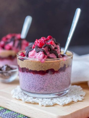 Raspberry Chia Pudding with almond butter and raspberry jam topped with banana raspberry ice cream and chocolate