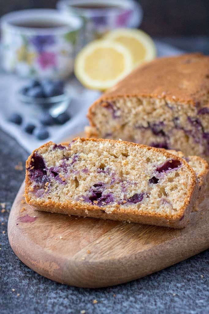 Healthy whole grain refined sugar-free Lemon Blueberry Pound Cake with fresh blueberries