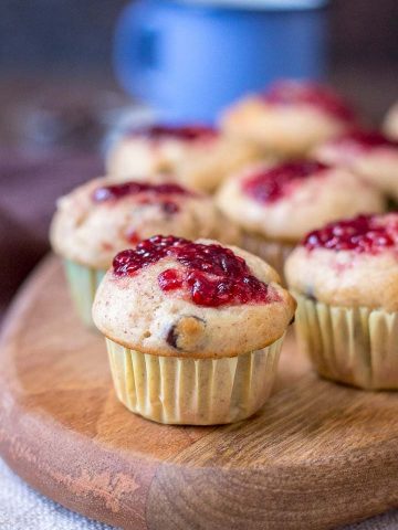 Mini Peanut Butter Banana Muffins with chocolate chips topped with raspberry jam