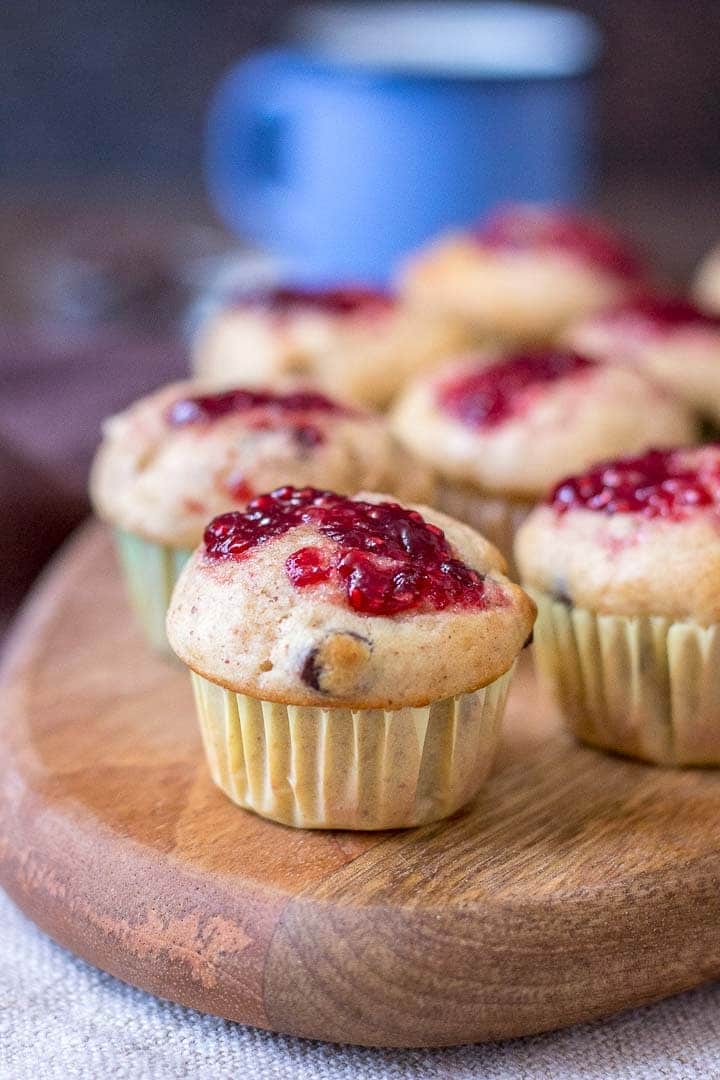 Mini Peanut Butter Banana Muffins with chocolate chips topped with raspberry jam