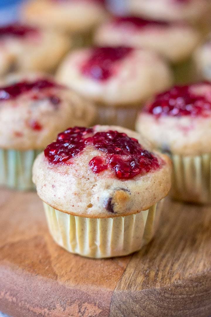 Mini Peanut Butter Banana Muffins with chocolate chips topped with raspberry jam