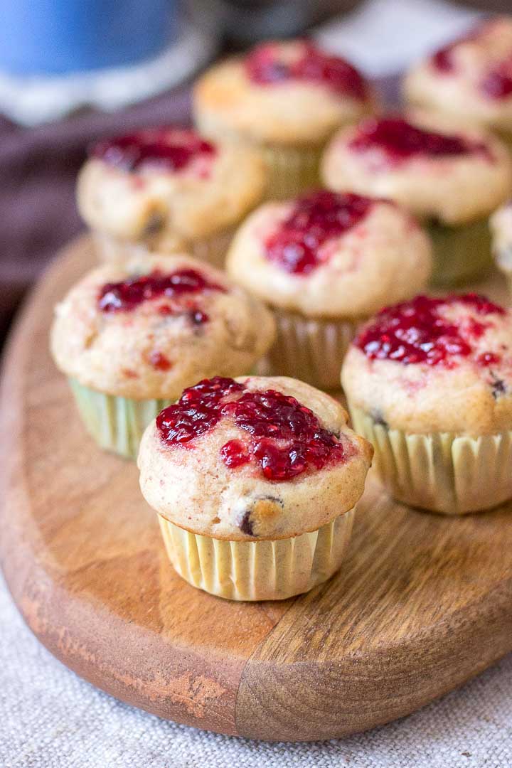 Mini Peanut Butter Banana Muffins with chocolate chips topped with raspberry jam