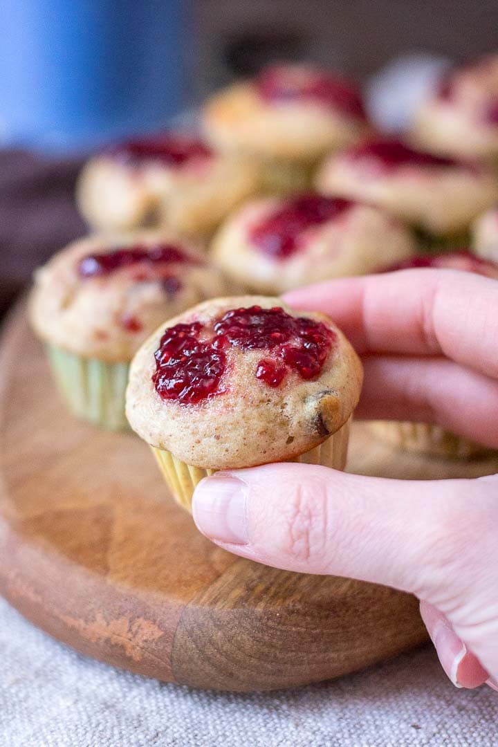 Mini Peanut Butter Banana Muffins with chocolate chips topped with raspberry jam