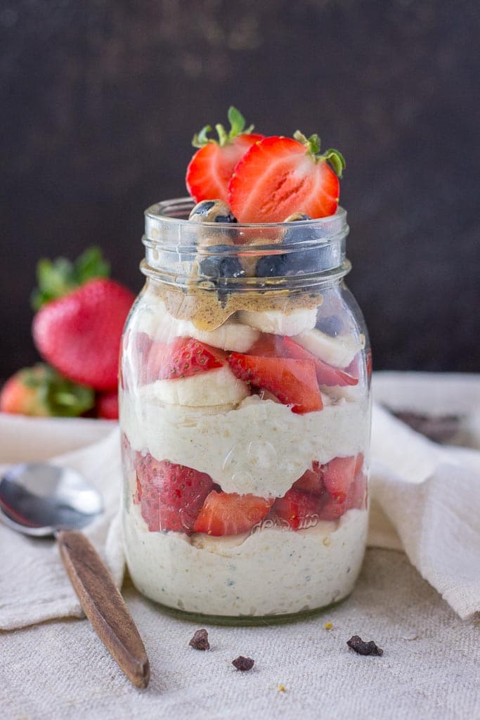 overnight oats with yogurt topped with strawberries and banana