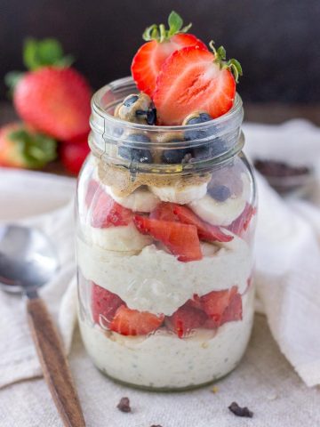 Strawberry overnight oats with yogurt topped with banana and almond butter