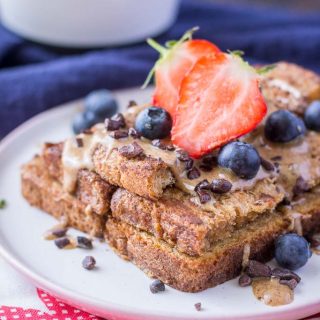 Healthy Cinnamon French Toast made with whole grain toast topped with almond butter and fruits