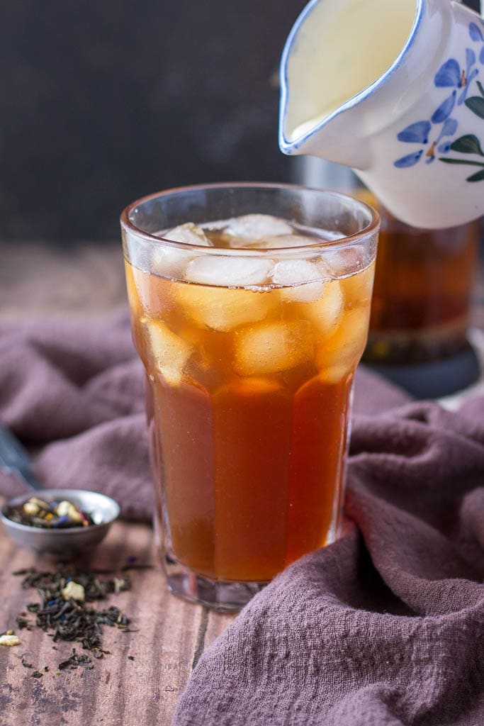 Cold Brewed Iced Earl Gray Latte served in a tall glass with ice cubes