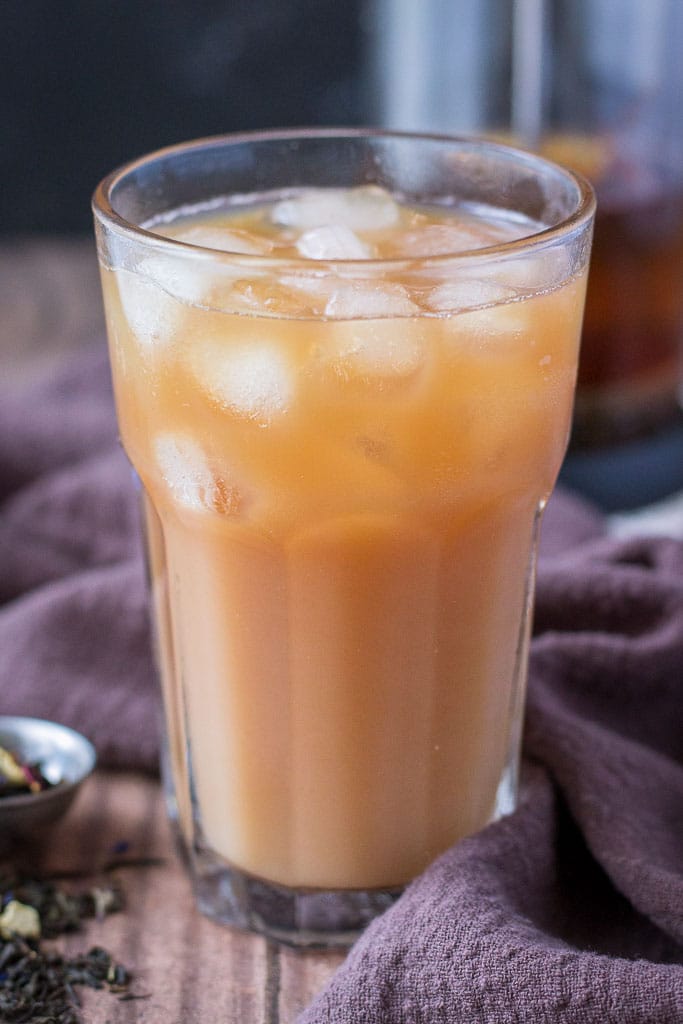 Cold Brewed Iced Earl Gray Latte with milk served in a tall glass with ice cubes