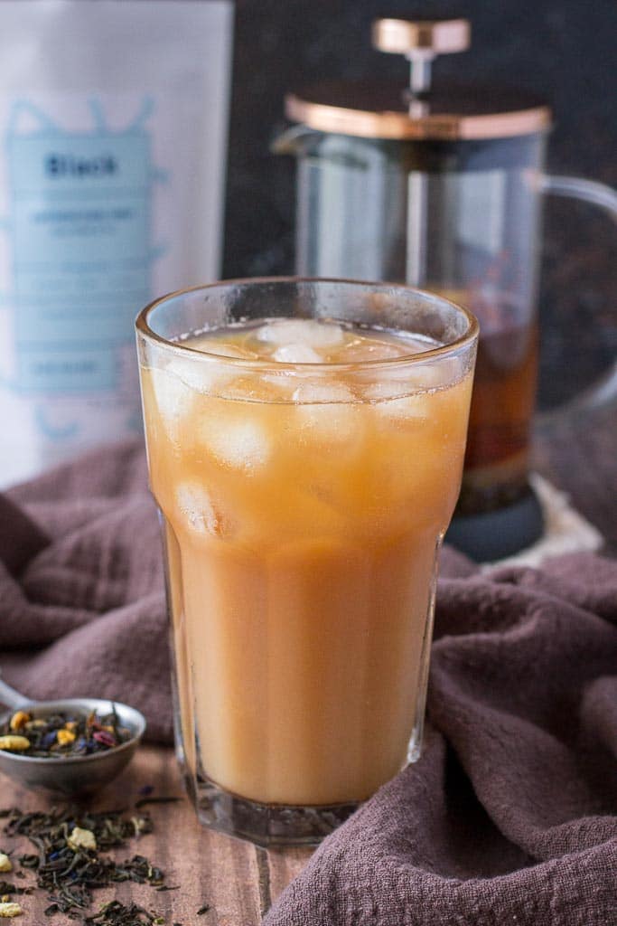 Cold Brewed Iced Earl Gray Latte with milk served in a tall glass with ice cubes