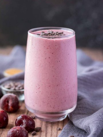 Cherry Banana Smoothie served in a glass topped with chocolate