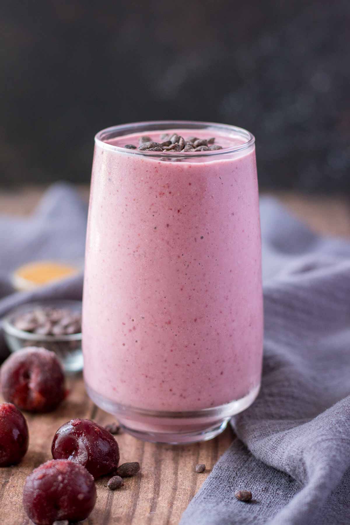 Cherry Banana Smoothie served in a glass topped with chocolate