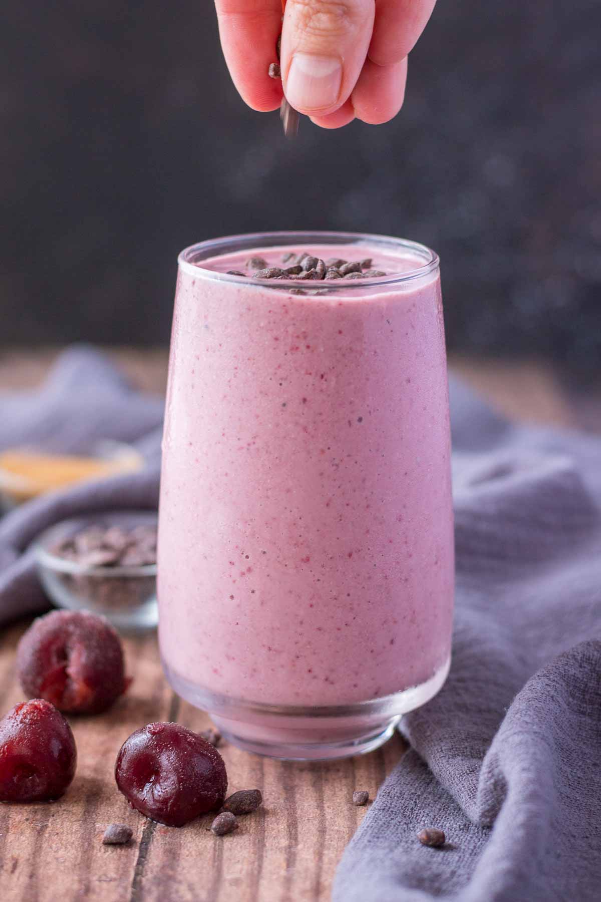 Cherry Banana Smoothie served in a glass topped with chocolate