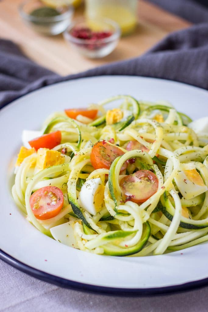 Egg Zucchini Noodle Salad with cherry tomatoes and mustard flaxseed oil vinaigrette