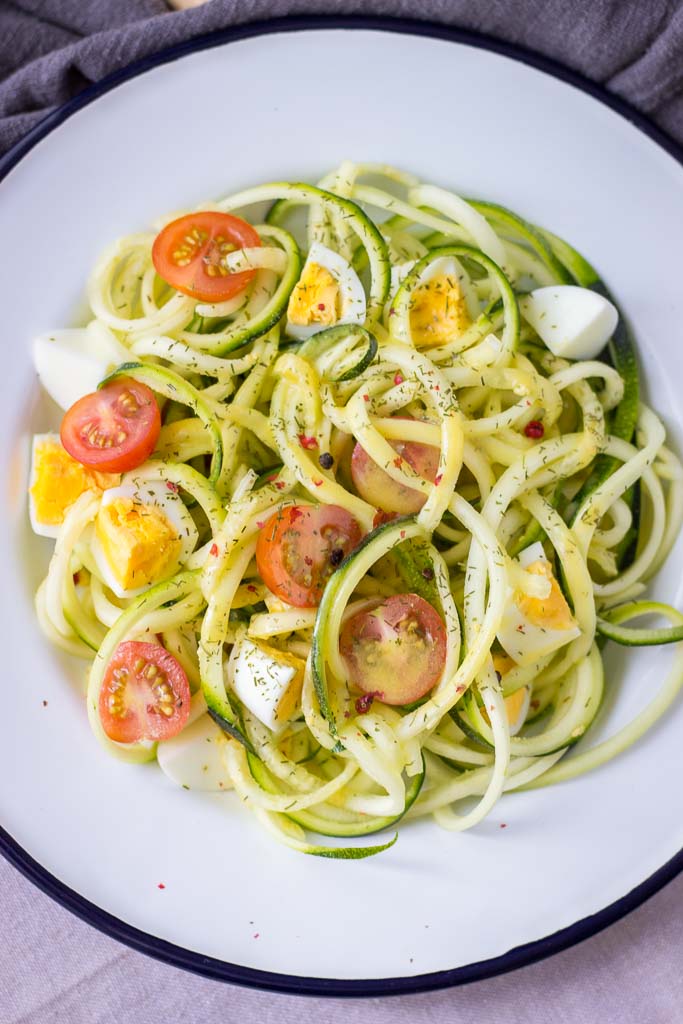Zucchini Noodle Salad with eggs cherry tomatoes and mustard vinaigrette