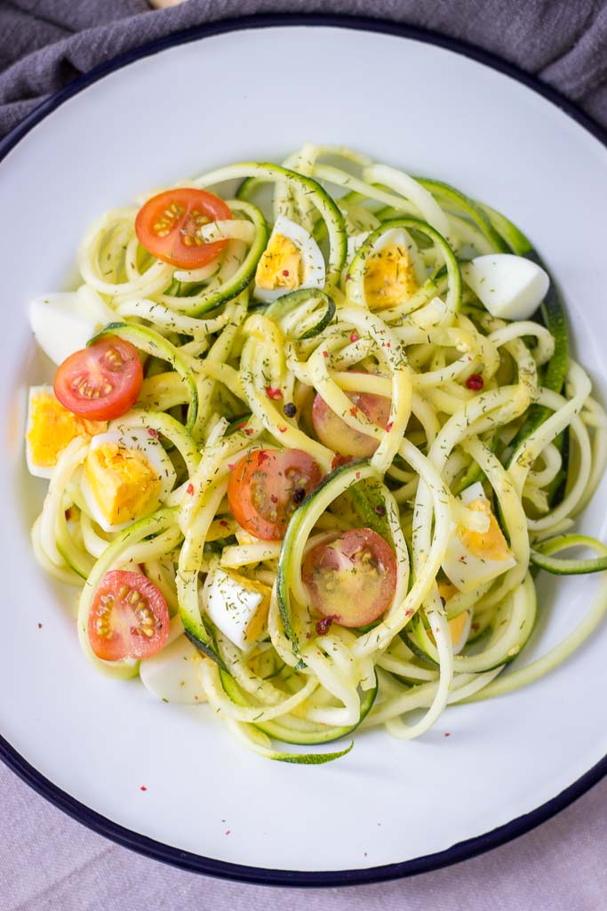 Zucchini Noodle Salad with eggs cherry tomatoes and mustard vinaigrette