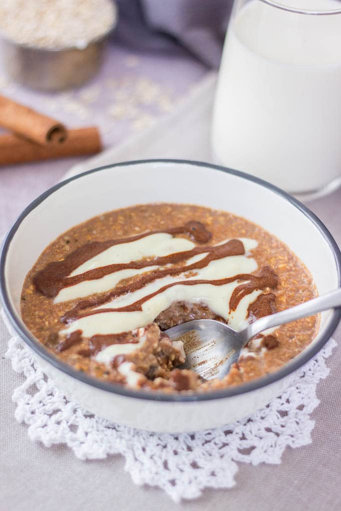 Healthy Cinnamon Roll Oatmeal porridge with cinnamon glaze served in a bowl