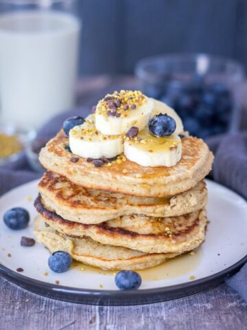 Blueberry Banana Pancakes recipe with oats topped with banana