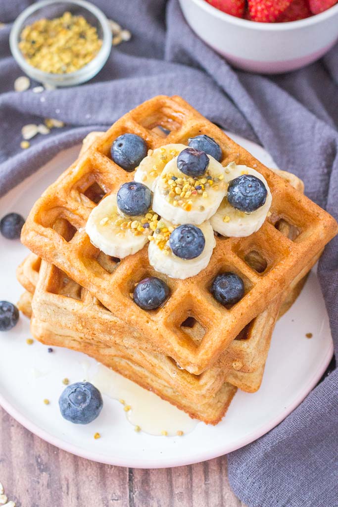 Healthy Oatmeal Waffles topped with blueberries and banana