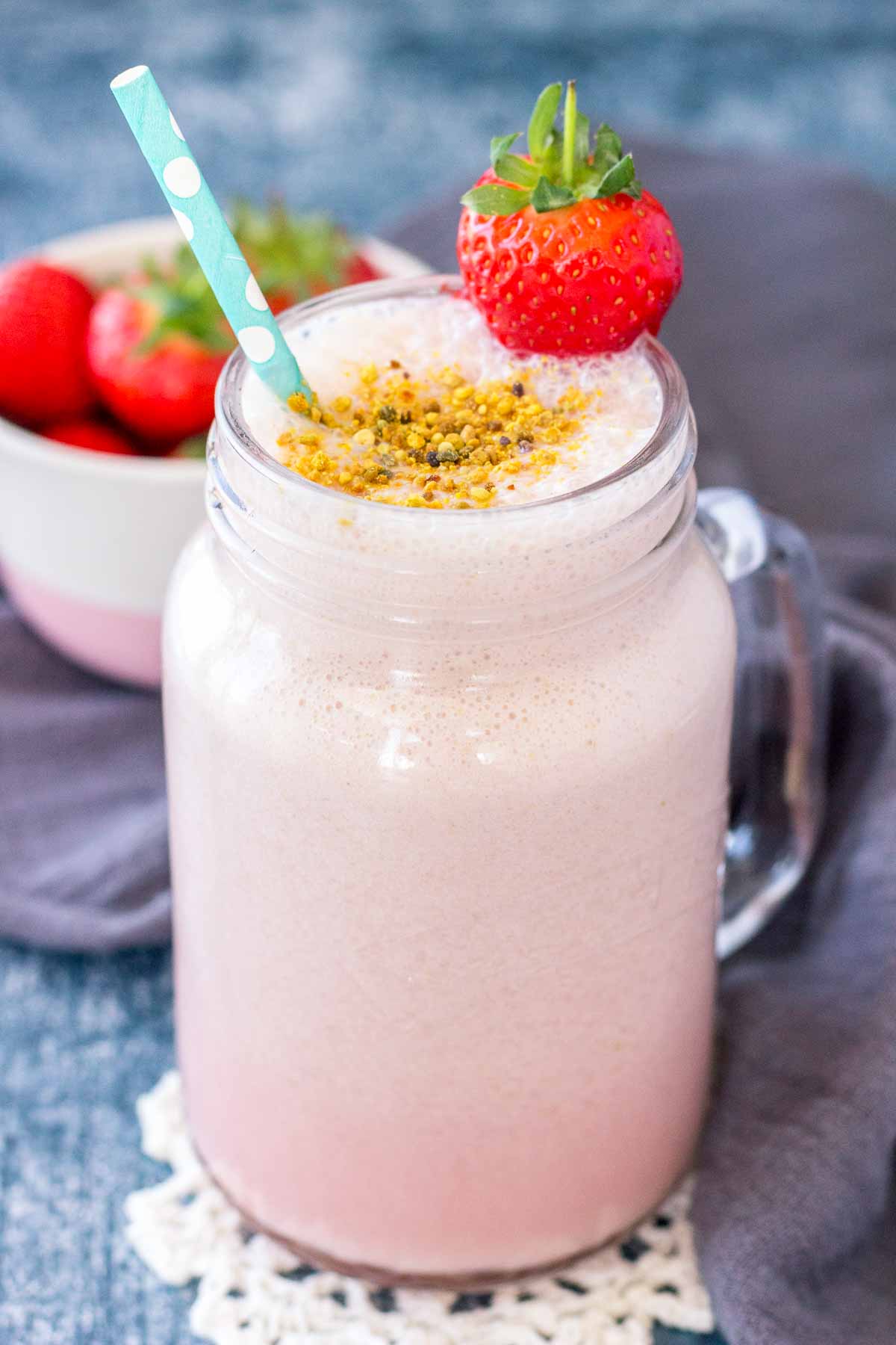 Strawberry Milk served in a tall glass with a straw